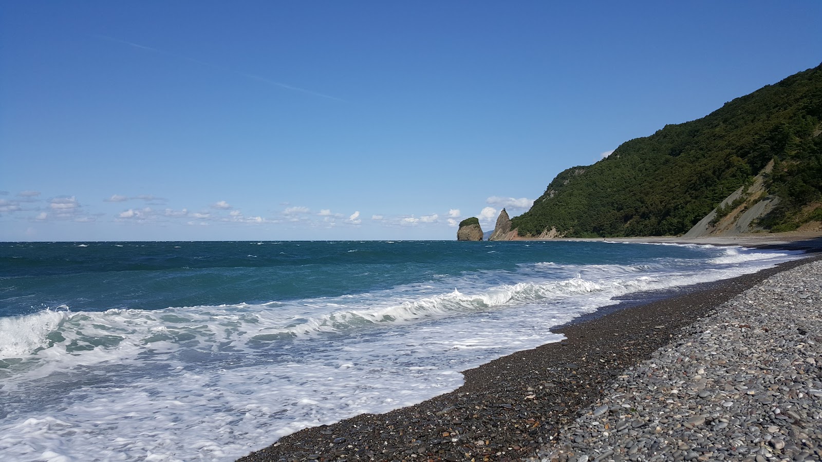 Foto di Kuscu Koyu Plaji con una superficie del ciottoli grigi
