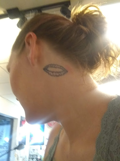 Explore harry styles tattoo ideas, creative tattoo ideas in Pikeville, available at The Carbon Canary Tattoo Studio