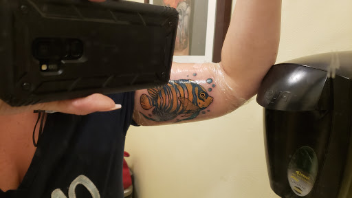 Explore elbow tattoo ideas for men, creative tattoo ideas in Coral Springs, available at The Levi & Lili Tattoo Company