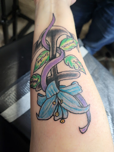 Find between the breast tattoo ideas for your next unique tattoo in Nicholasville at Castle of Color