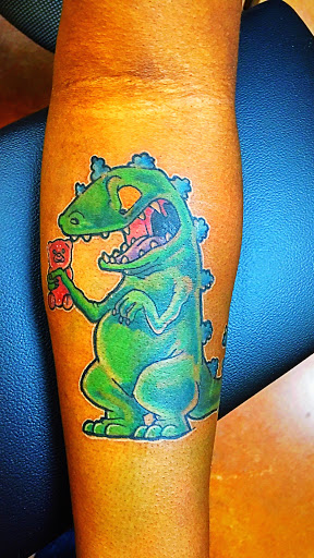 Explore 2004 tattoo ideas, creative tattoo ideas in Arlington, available at Urbans Tattoo & Piercing Studio