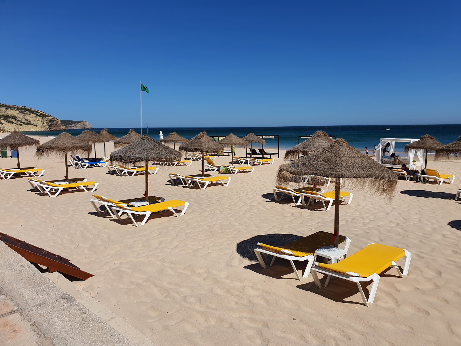 Photo of Praia da Salema surrounded by mountains