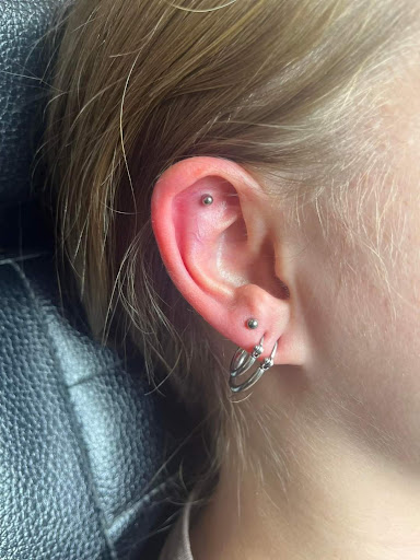 Find small tattoo between breast ideas for your next unique tattoo in Valparaiso at Elysium Studios