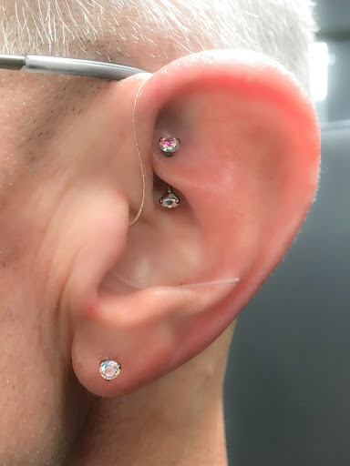 Find tattoo ideas for in between breast for your next unique tattoo in Springfield at Body Piercing By Qui Qui