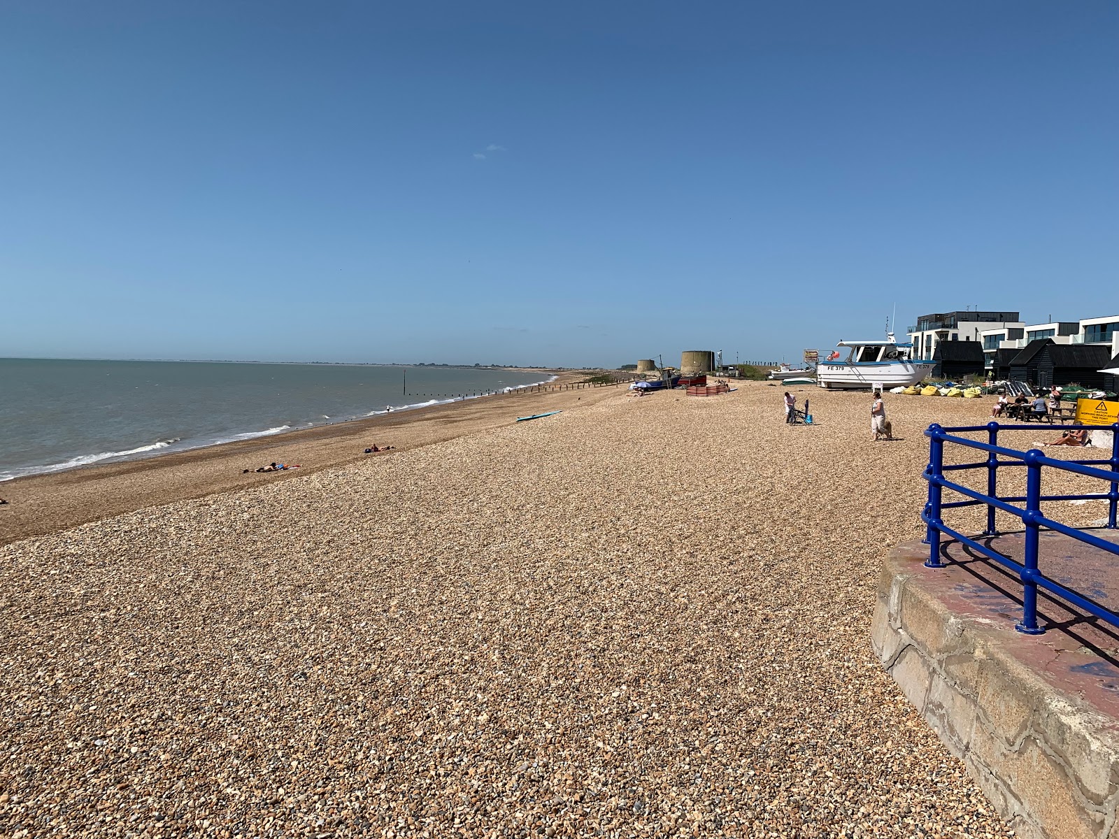 Photo of Hythe beach with blue pure water surface