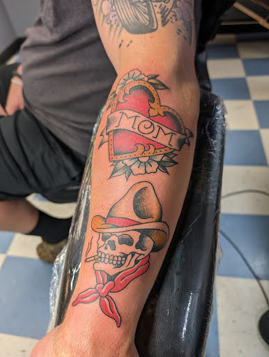 Explore male inner bicep tattoo ideas, creative tattoo ideas in Elkin, available at Black Bear Tattoo