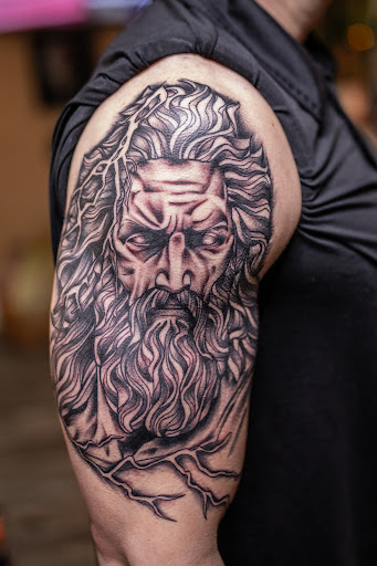 Explore flower leg tattoo ideas, creative tattoo ideas in Leesville, available at Revolution Ink Tattoo and Art Gallery