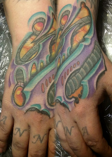 Explore wrap around wrist tattoo ideas, creative tattoo ideas in Fritch, available at Stars & Stripes Electric Tattoos