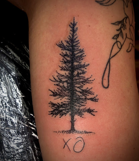 Find women's rib tattoo ideas for your next unique tattoo in North Tonawanda at Dark Side Ink Tattoo Studio