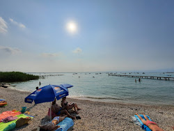 Zdjęcie Spiaggia porto di Pacengo z poziomem czystości wysoki