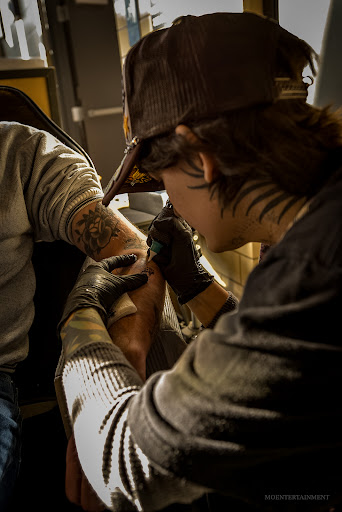 Find book of tattoo ideas for your next unique tattoo in Springfield at Triumph Tattoo