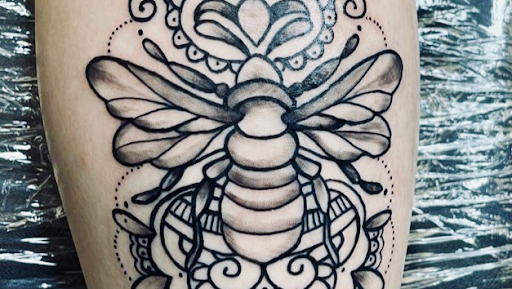 Find tattoo ideas moon and sun for your next unique tattoo in Lake City at Crooked Spines Tattoo Studio