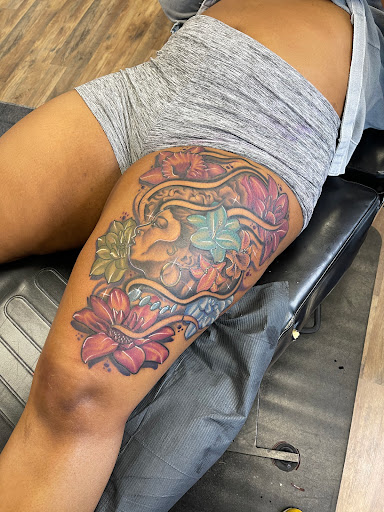 Explore cancer ribbon tattoo ideas, creative tattoo ideas in Alexandria, available at WreckLezz iNK Tattoo Studio