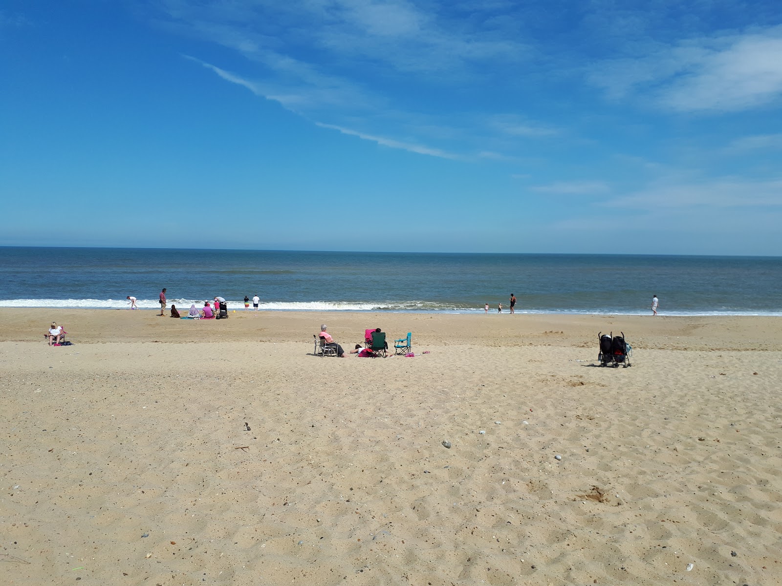Photo of Hemsby beach with blue pure water surface