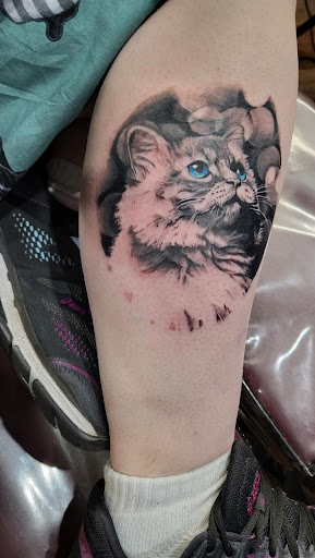 Explore upper arm men tattoo ideas, creative tattoo ideas in Clarksville, available at Dark Raine Tattoo