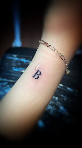 Explore coldplay tattoo ideas, creative tattoo ideas in Shelbyville, available at Body Art by Red