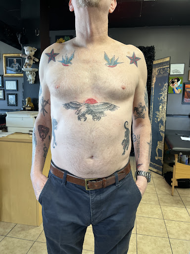 Explore guitar pick tattoo ideas, creative tattoo ideas in Houston, available at 333 Tattoo Studio HTX