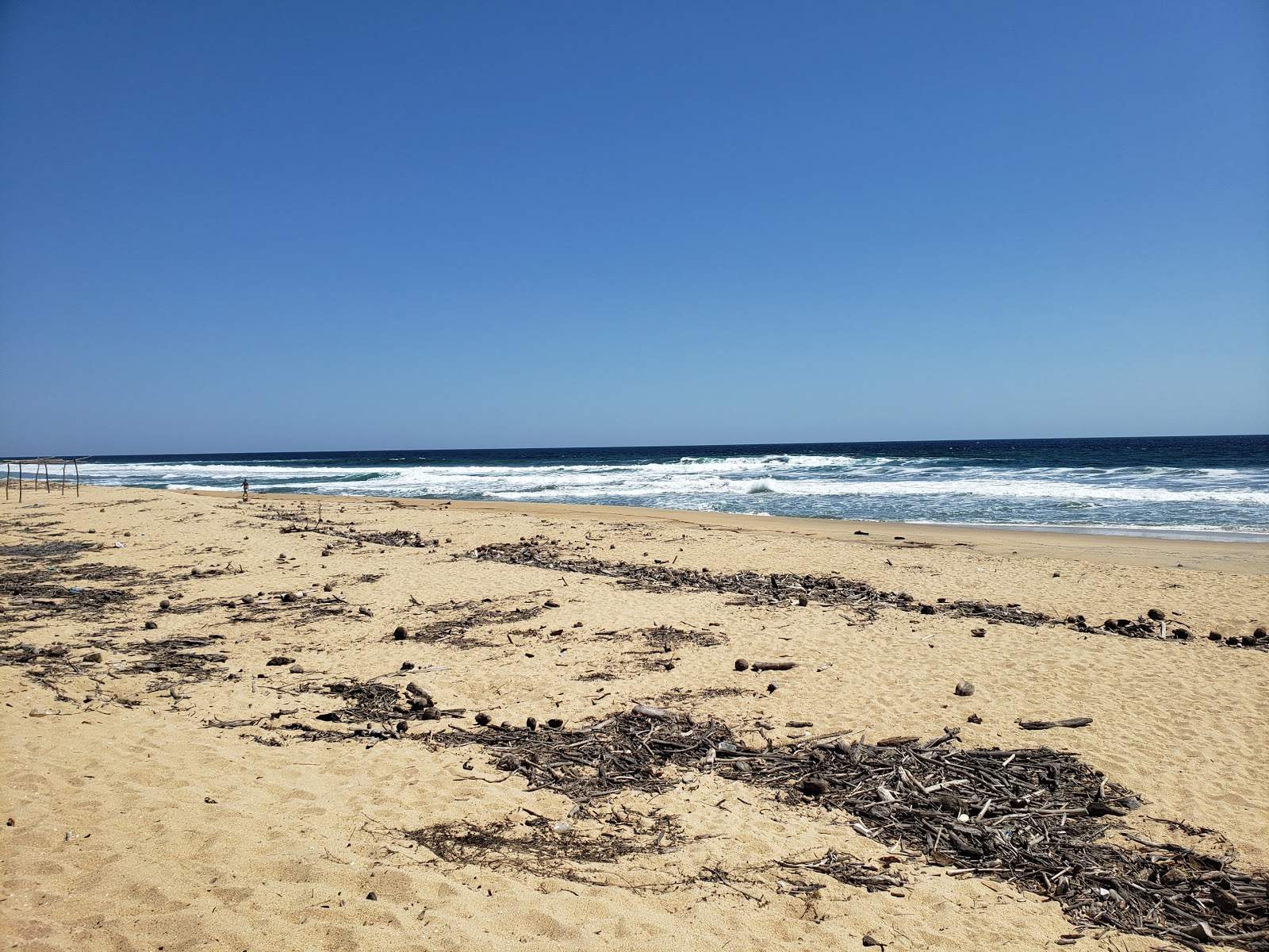 Foto di Playa Mata de Mangle con una superficie del acqua turchese