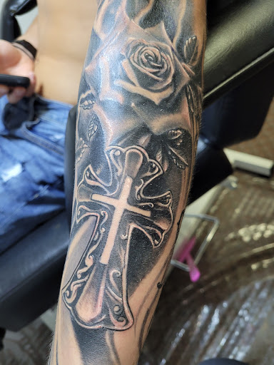 Explore angel tattoo ideas, creative tattoo ideas in Angola, available at Hoodlum Ink