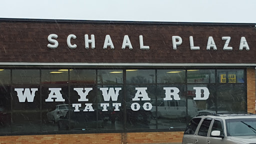 Explore women's lower back tattoo ideas, creative tattoo ideas in Erie, available at Wayward Tattoo Studio