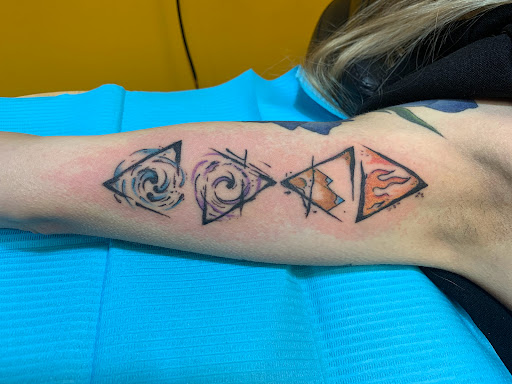 Explore dog tattoo ideas for men, creative tattoo ideas in Brunswick, available at Blue Fin Tattoos