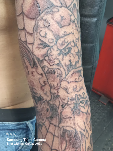 Explore upper back tattoo ideas male, creative tattoo ideas in Cranston, available at Kabloom Tattoo Studio