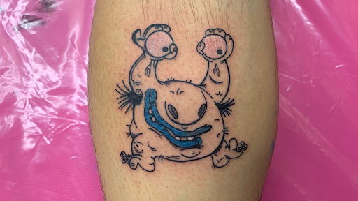 Explore black heart heart tattoo cover up ideas, creative tattoo ideas in Lake City, available at Crooked Spines Tattoo Studio