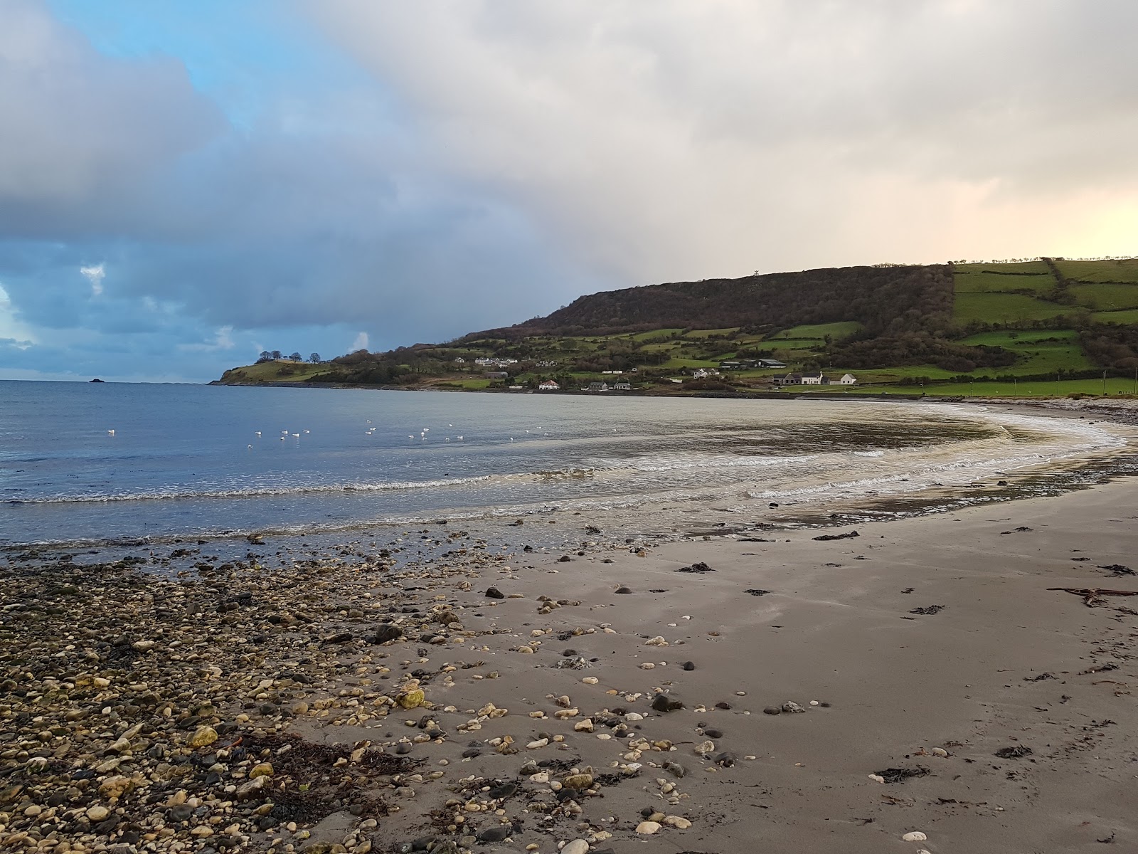 Photo of Carnlough Beach with turquoise water surface