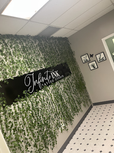 Explore tattoo ideas behind the ear tattoos, creative tattoo ideas in East Amherst, available at Infinite Ink Tattoo Studio