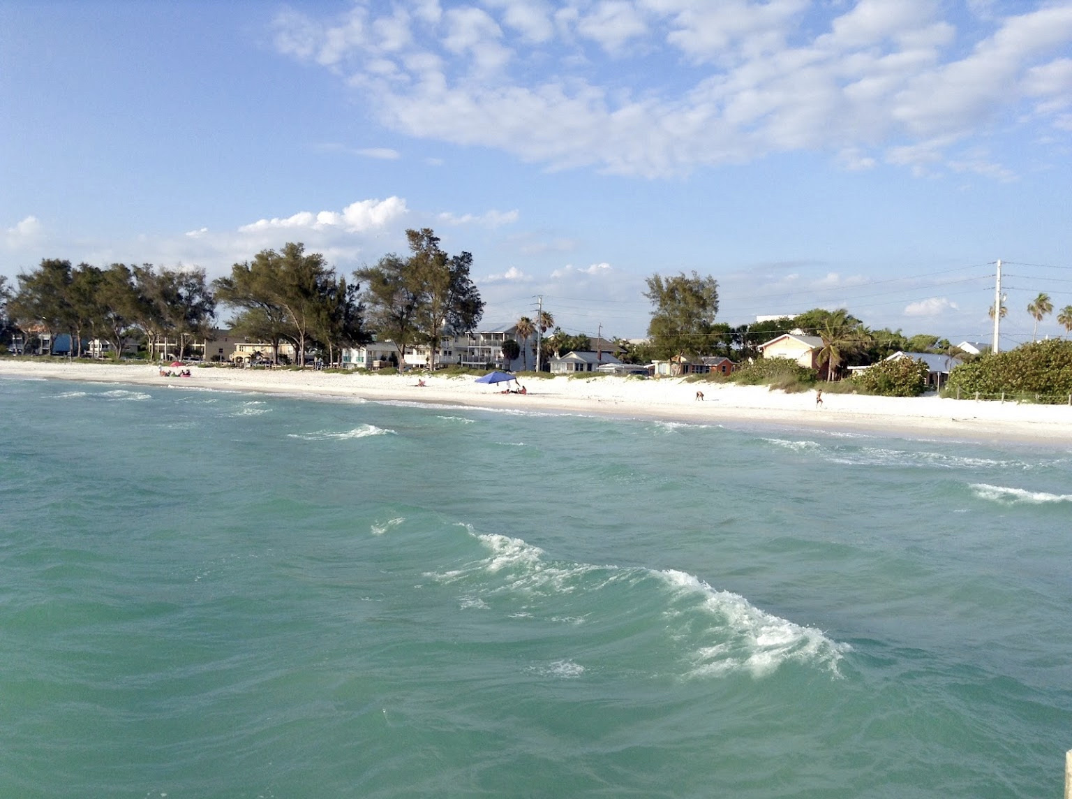 Foto av Coquina beach med lång rak strand