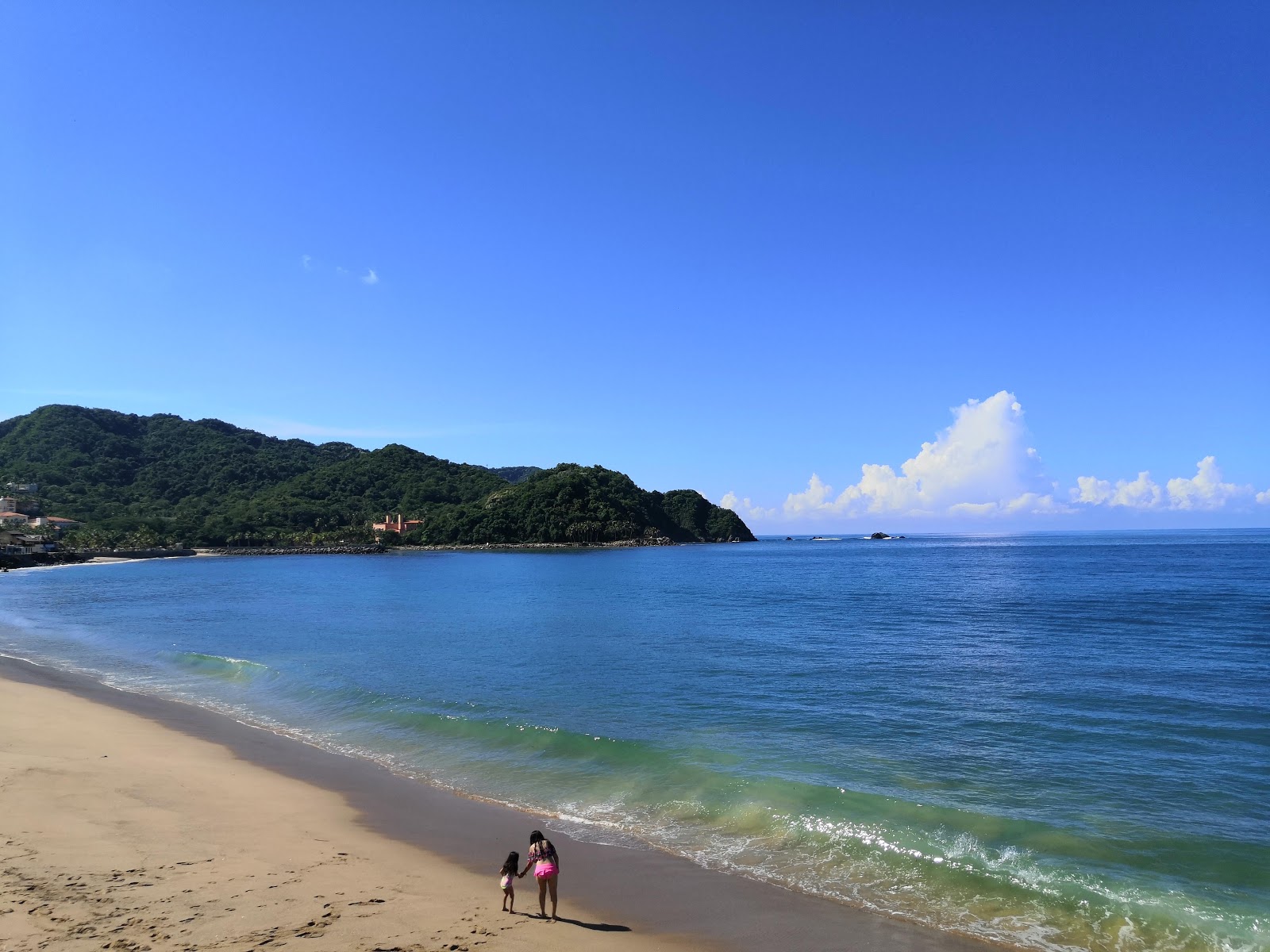Photo de Playa Navidad avec rivage droit, long