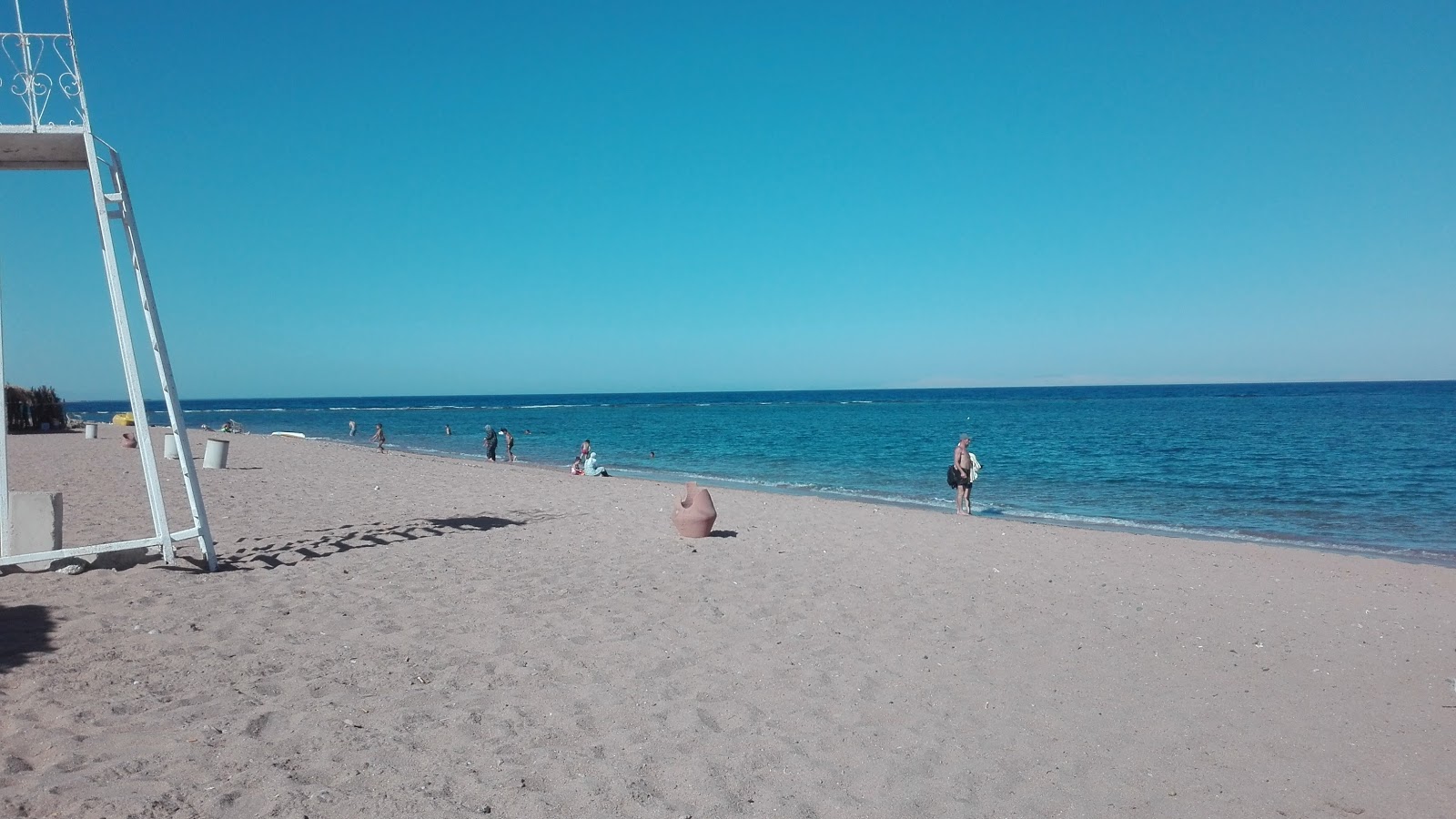 Foto de Mousa Bay con arena beige superficie