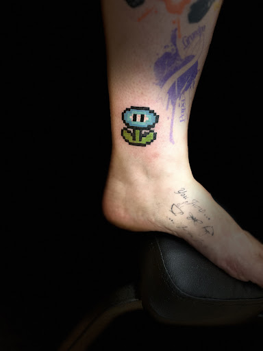 Explore jersey tattoo ideas, creative tattoo ideas in New Hampton, available at Crescent Moon Tattoo