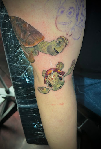 Find in between boob tattoo ideas for your next unique tattoo in Silver City at Independent Ink Tattoo
