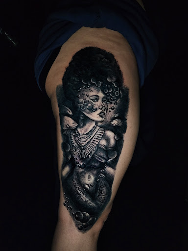 Find tattoo necklace ideas for your next unique tattoo in Oklahoma City at Creative Tattoos