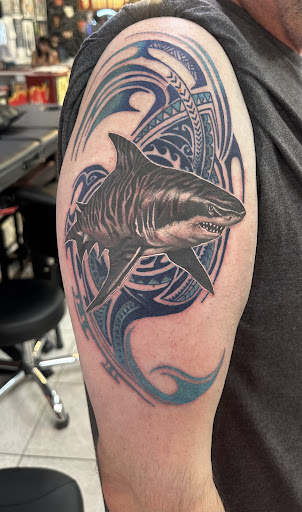 Explore slipknot tattoo ideas, creative tattoo ideas in Honolulu, available at Sacred Art Tattoo Waikiki