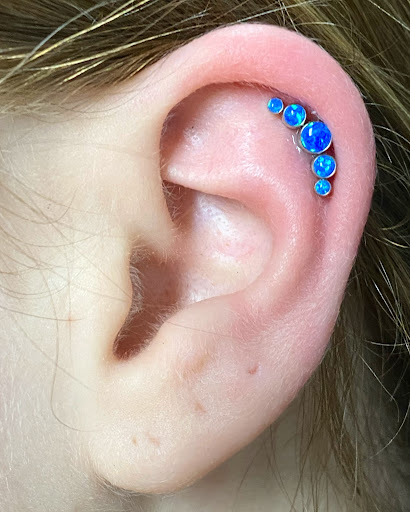 Explore leg flower tattoo ideas, creative tattoo ideas in Oswego, available at Bodified