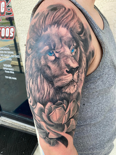 Explore brass knuckle tattoo ideas, creative tattoo ideas in Largo, available at Alchemy Tattoos and Body Piercings