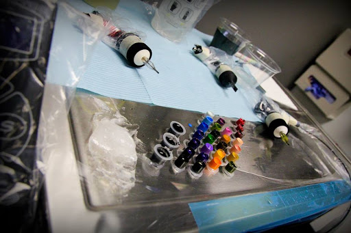 Explore red tattoo ideas women, creative tattoo ideas in Dover, available at TATTOO MAFIA, INC.