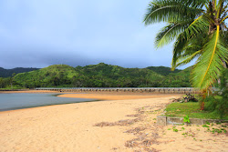 Foto von Naviti Beach und die siedlung
