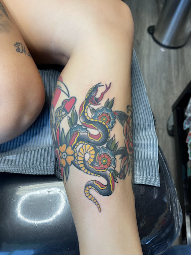 Explore flower arm tattoo ideas, creative tattoo ideas in Liberty, available at Dark Lotus Tattoo & Salon