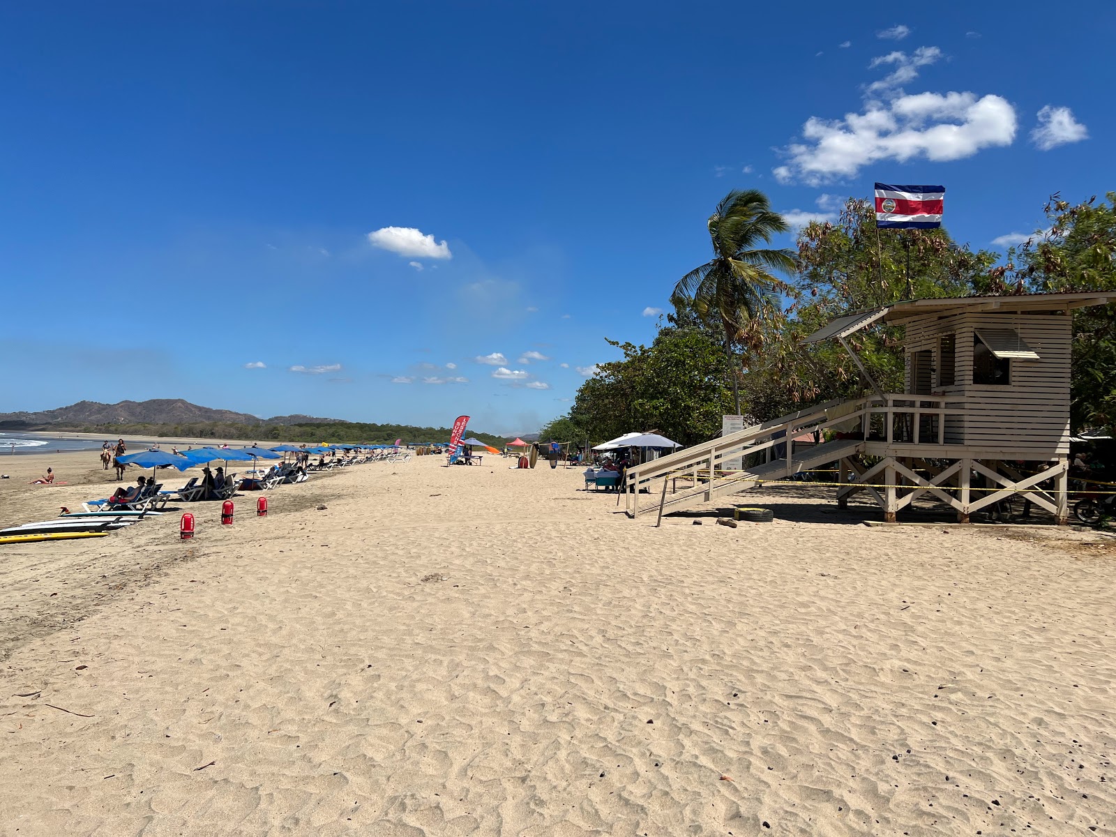 Foto av Tamarindo Beach med lång rak strand
