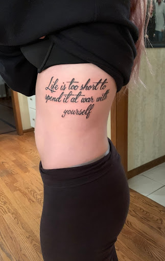 Explore neck tattoos for women ideas, creative tattoo ideas in Batavia, available at Tried & True Tattoo