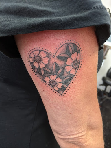 Explore womens neck tattoos ideas, creative tattoo ideas in Slippery Rock, available at Dinky Dachshund Tattoo Parlor