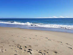 Mugu beach'in fotoğrafı geniş bir kıyı şeridi ile birlikte