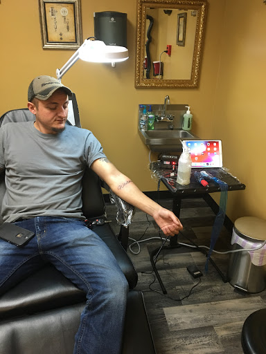 Explore ambigram tattoo ideas, creative tattoo ideas in Warner Robins, available at Untold Pain Tattoo Studio