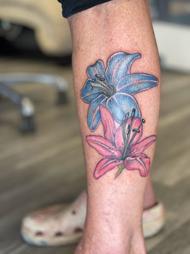 Explore dirt bike tattoos ideas, creative tattoo ideas in Watford City, available at Soulful Ink Studios