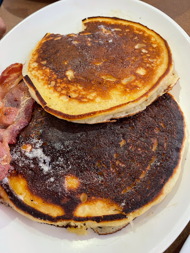 Two stack with bacon. One pancake over cooked 😞 