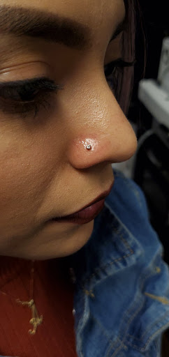 Explore fine line spine tattoo ideas, creative tattoo ideas in Bakersfield, available at KUSTOM CREATIONS TATTOO & PIERCING STUDIO