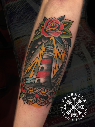 Explore hand tattoo ideas male, creative tattoo ideas in Rogers, available at Valhalla Tattoo & Piercing Studio